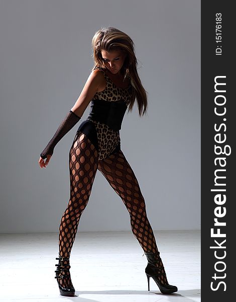 Modern style dancer posing on studio background. Modern style dancer posing on studio background