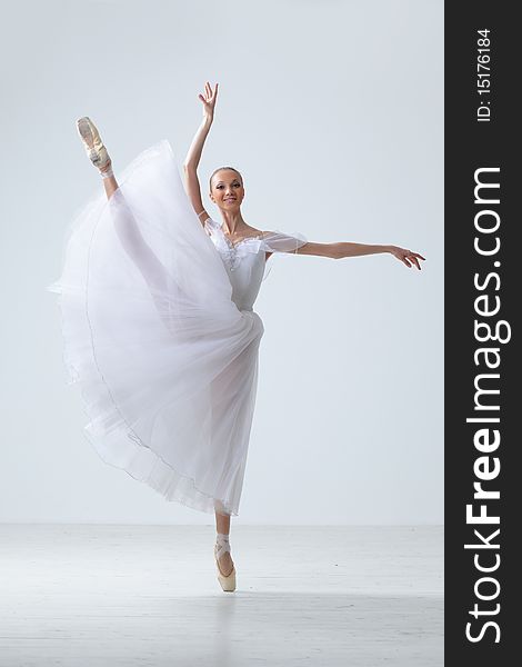 Modern style dancer posing on studio background. Modern style dancer posing on studio background