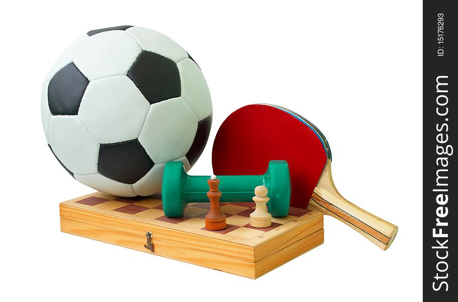 Football, wooden chess board, green dumbbell and tennis racket. Isolated on white background. Football, wooden chess board, green dumbbell and tennis racket. Isolated on white background.