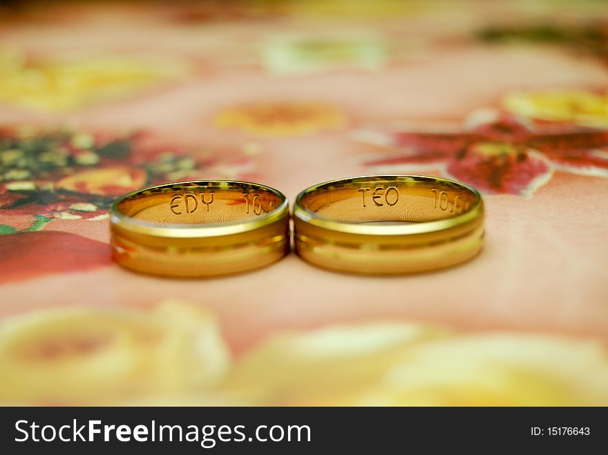 Two rings with initial engraved inside.