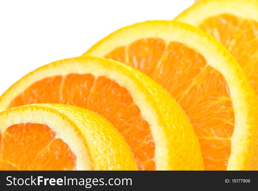 Close-up ripe slice orange on white background