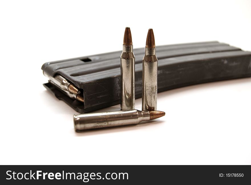 A pair of rifle magazines with extra rounds. A pair of rifle magazines with extra rounds.