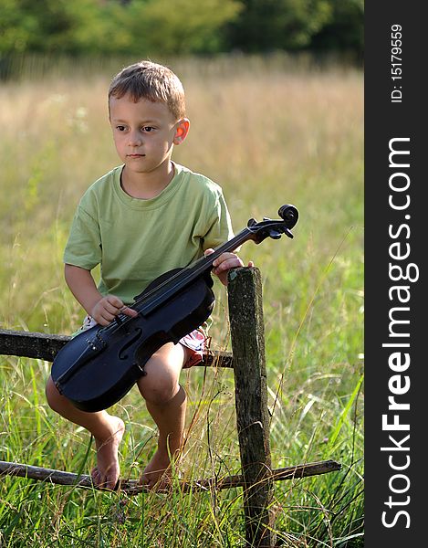 Portrait of a child playing the violin. Portrait of a child playing the violin