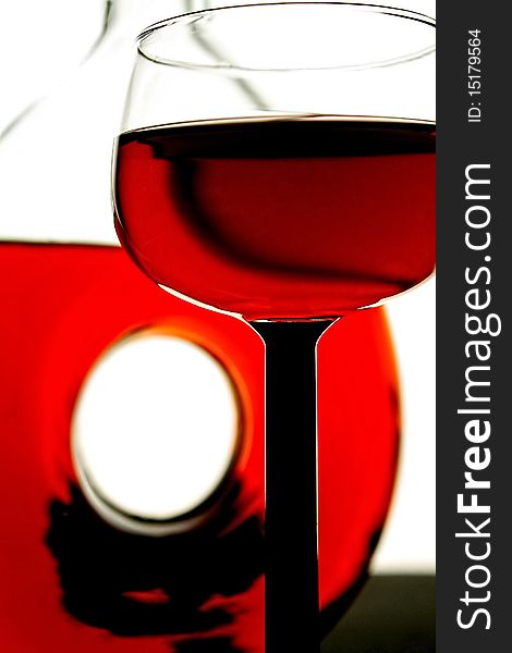 Abstract glassware background design made from a wine glass and bottle . Abstract glassware background design made from a wine glass and bottle .