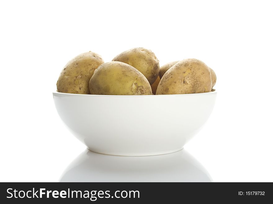 Potatoes in a white plate isolated on a white background