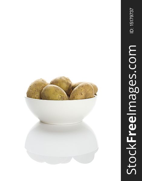 Potatoes in a white plate isolated on a white background