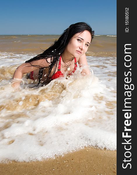 Sexy young adult woman at the sea