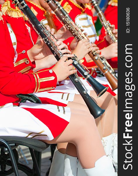 Girl Brass Band in red uniform performing