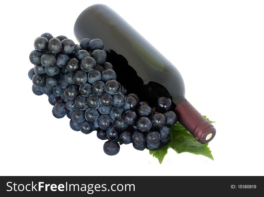 Red Wine and Grapes with leaves isolated on white background