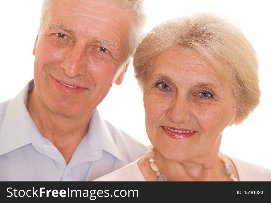 Elderly couple together on a white