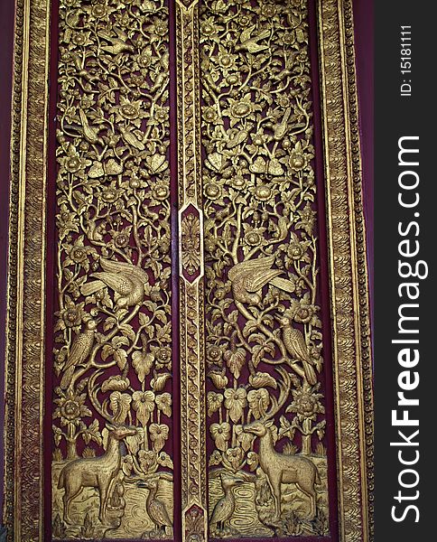 Traditional thai style wood carving on the door