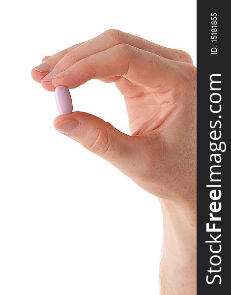 Male hand with pill over white background