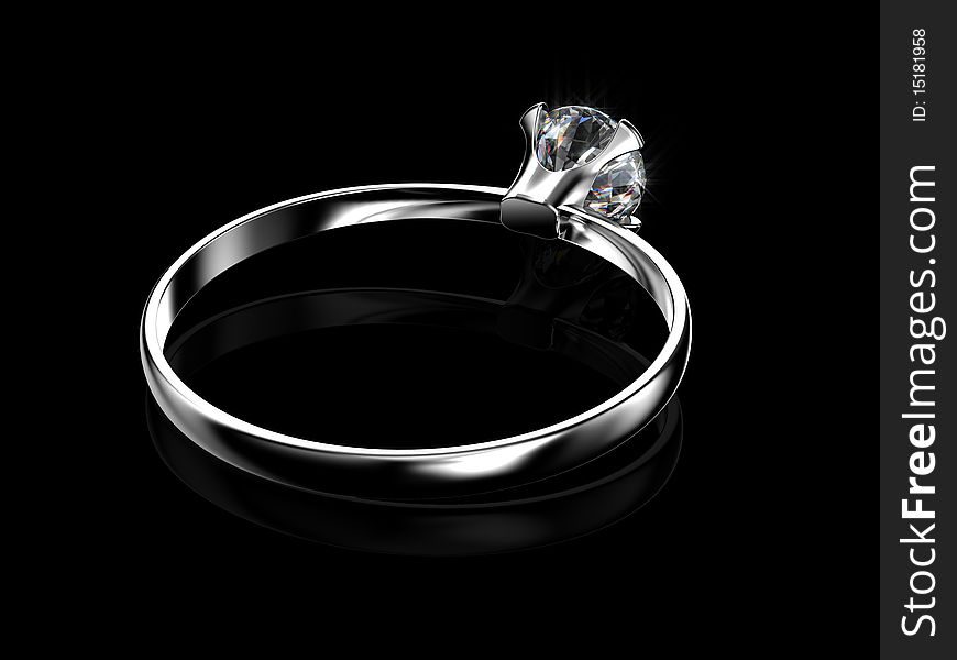 Diamond ring on black surface