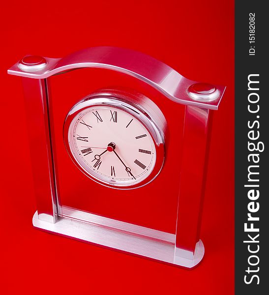 Mechanical clock on a red background
