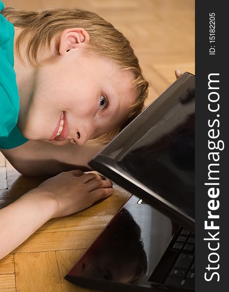 Boy peering into a laptop