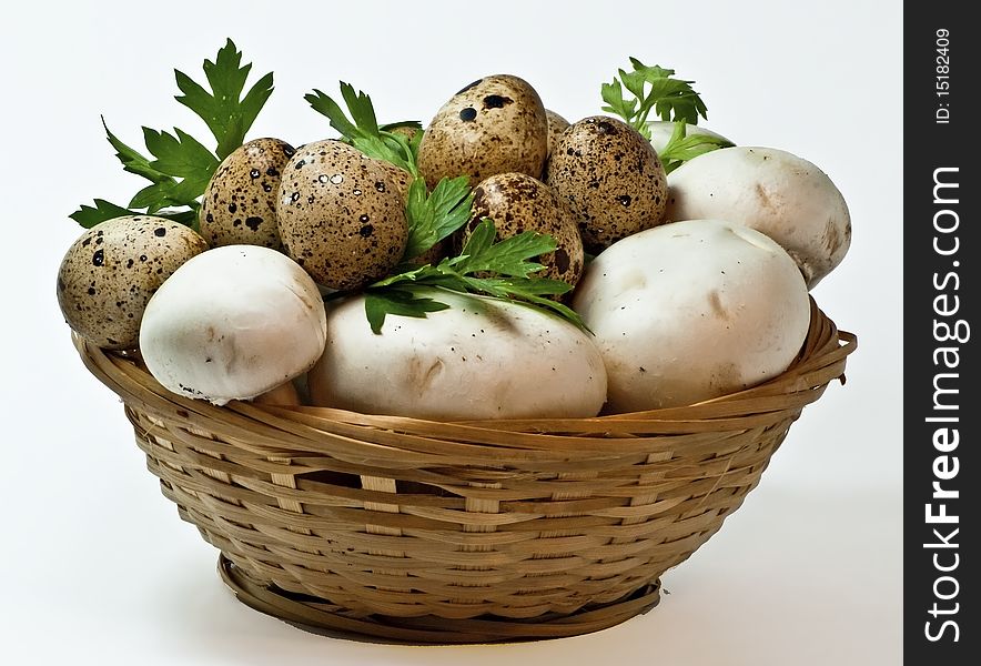 Quail eggs and mushrooms in the basket