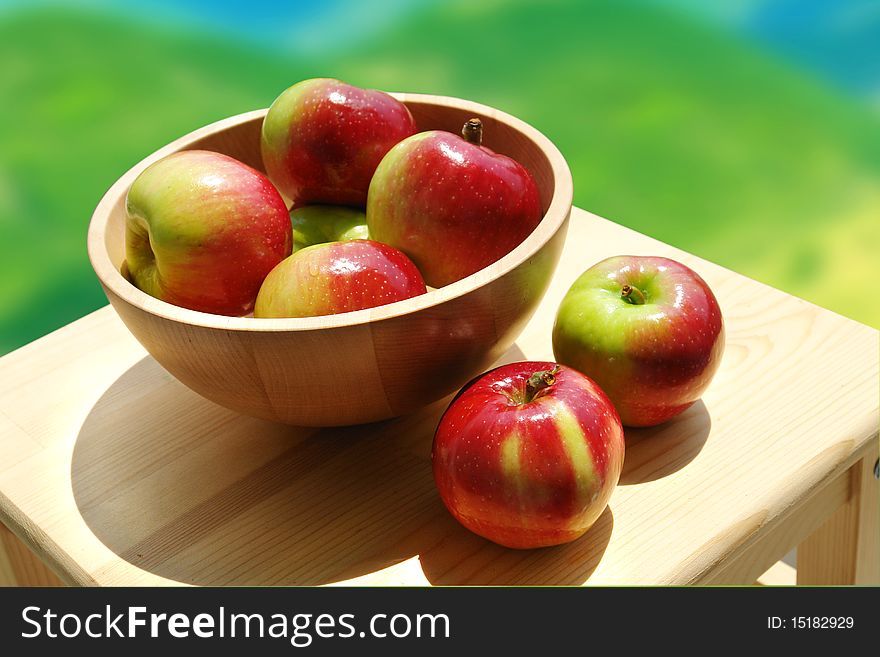 Bowl of fresh apples on wooden surface. Bowl of fresh apples on wooden surface