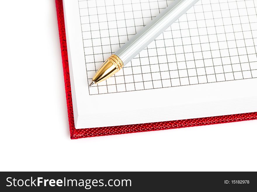 Red notebook with silver pen