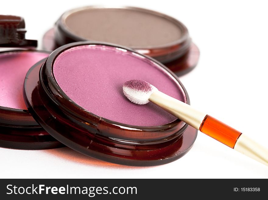 Make-up eyeshadows and cosmetic brush