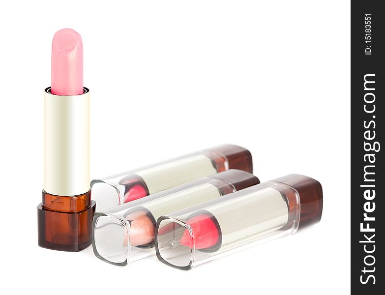 Pink lipsticks on white background