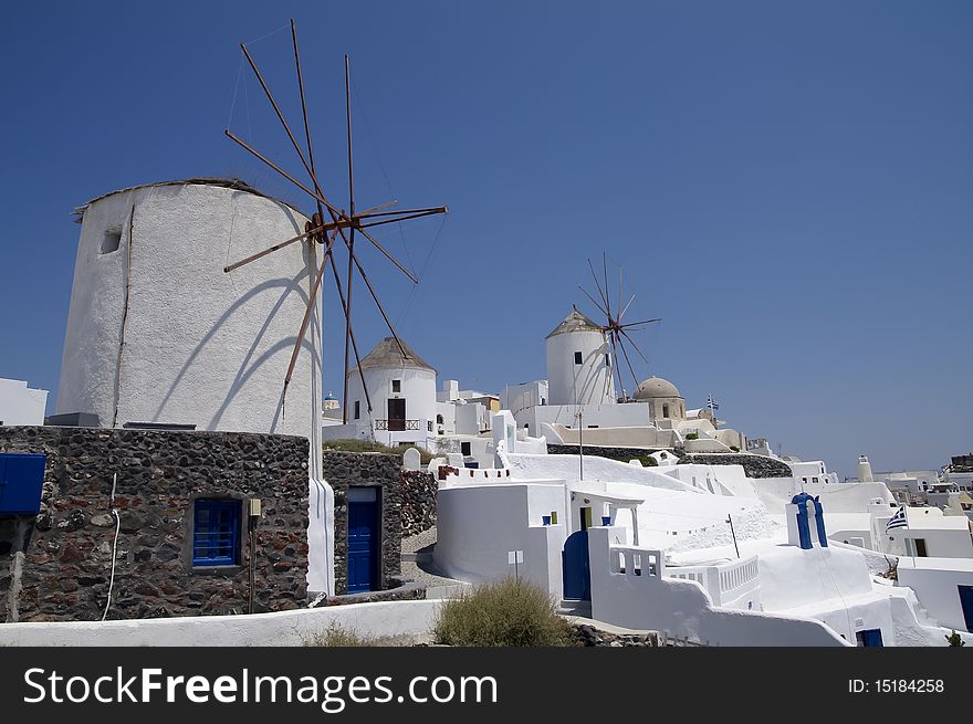 Windmills In Santorini Island