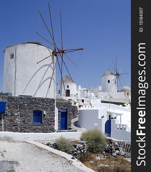 Windmills In Santorini Island