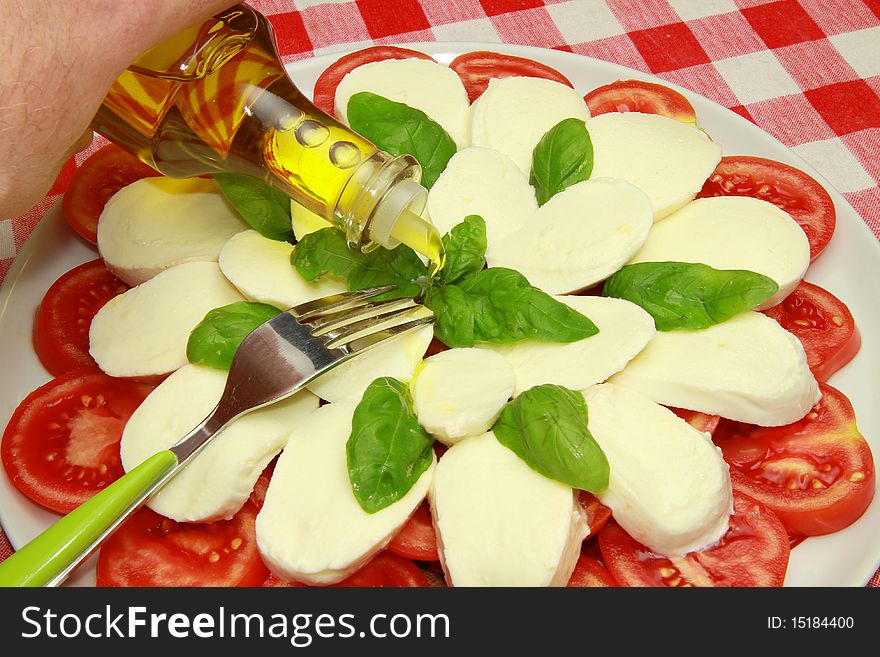 A dish with mozzarella and tomatoes