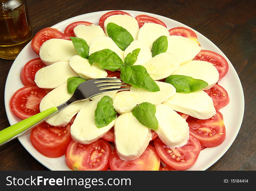 A dish with mozzarella and tomatoes