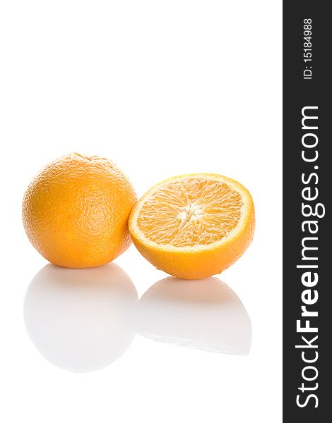 Two perfectly fresh oranges isolated on white. Two perfectly fresh oranges isolated on white