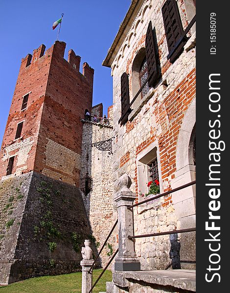 The fortified keep and battlements of an Italian castle. The fortified keep and battlements of an Italian castle