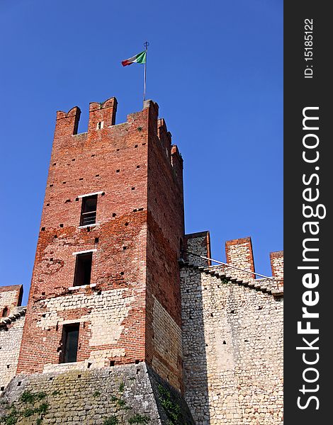 The fortified keep and battlements of an Italian castle. The fortified keep and battlements of an Italian castle