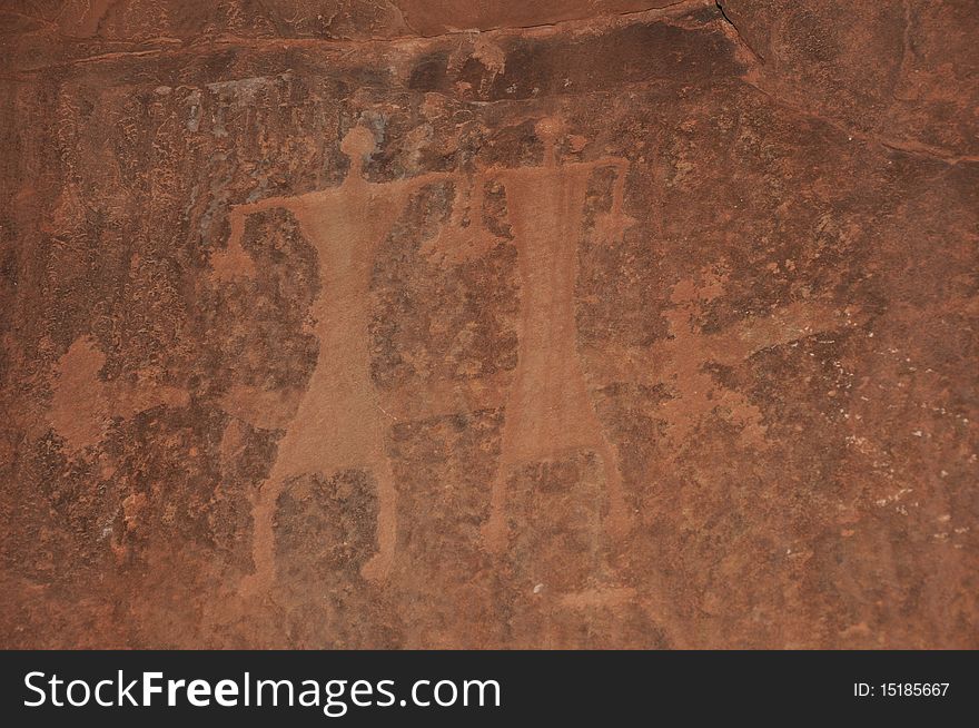 Images of people carved into a rock wall at Wadi Rum, a UNESCO World Heritage site in Jordan. Images of people carved into a rock wall at Wadi Rum, a UNESCO World Heritage site in Jordan.