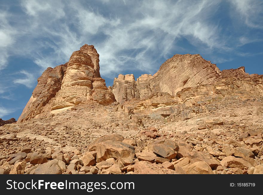 Rock hills above the famous Lawrence Spring, named after Lawrence of Arabia, in Wadi Rum, a UNESCO World Heritage Site in Jordan. Rock hills above the famous Lawrence Spring, named after Lawrence of Arabia, in Wadi Rum, a UNESCO World Heritage Site in Jordan.