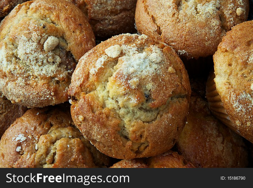 Horixontal photo of fresh muffins with sugar