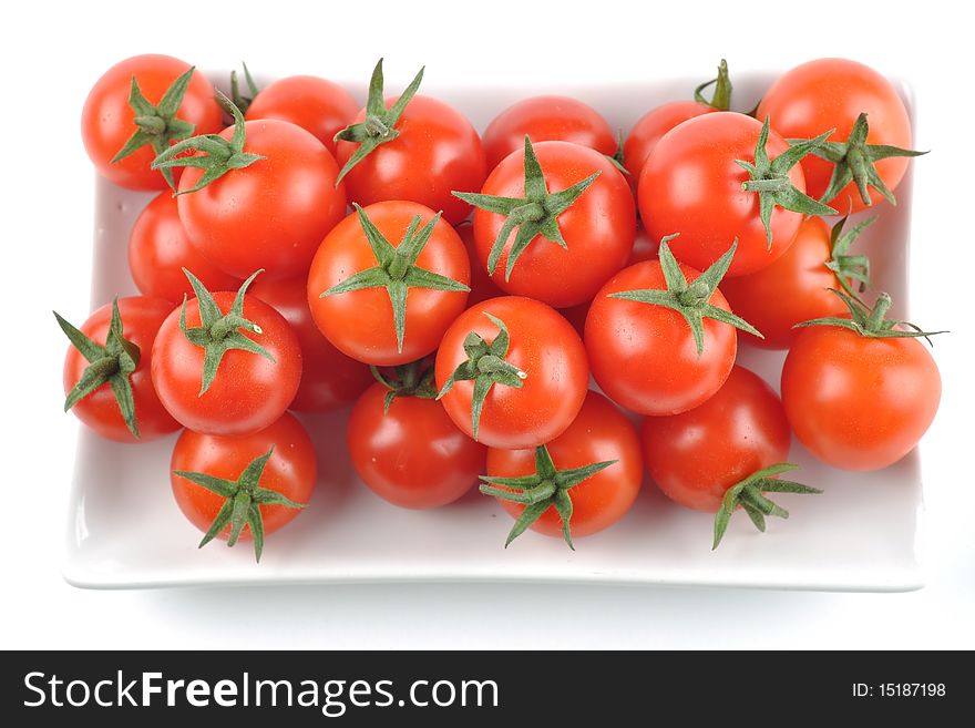 Freshly picked cherry tomatoes isolated on white background