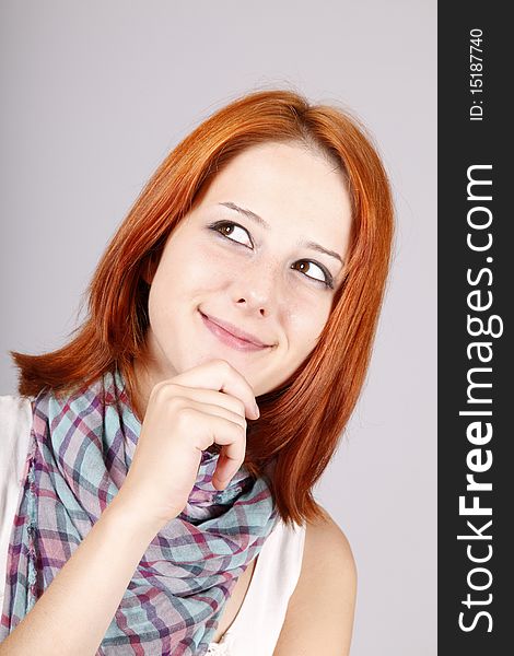 Portrait of beautiful red-haired girl. Studio shot.