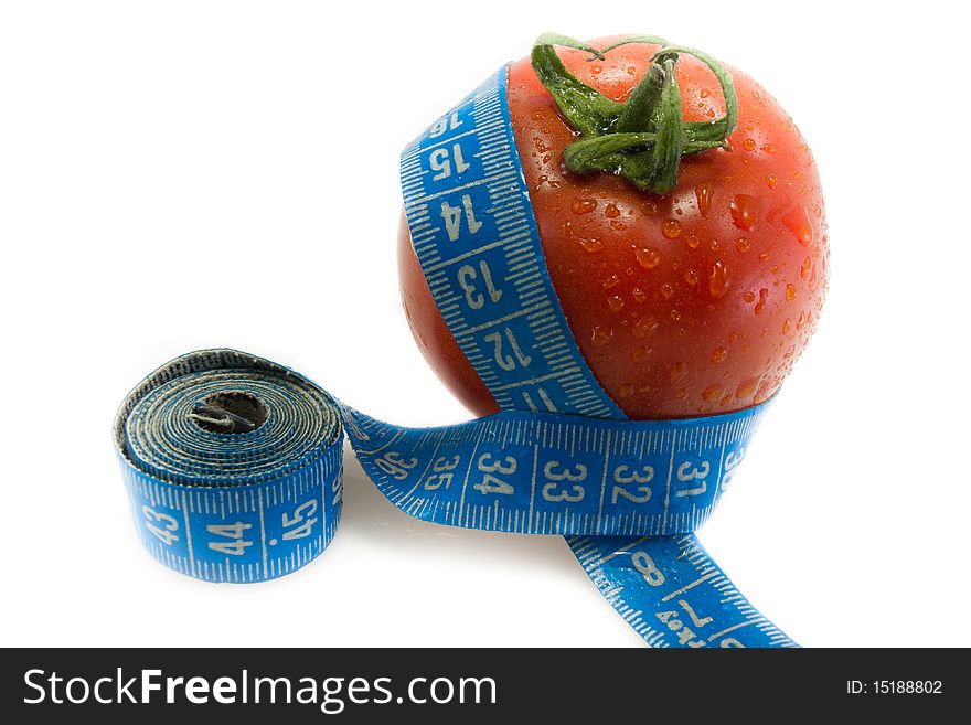 Red tomato with blue measurement tape and drops of water. Red tomato with blue measurement tape and drops of water