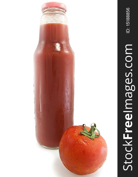 Big bottle of tomato juice and a red tomato isolated on white background. Big bottle of tomato juice and a red tomato isolated on white background