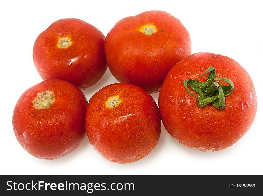 Juicy red tomatoes with water drops isolated on white. Juicy red tomatoes with water drops isolated on white