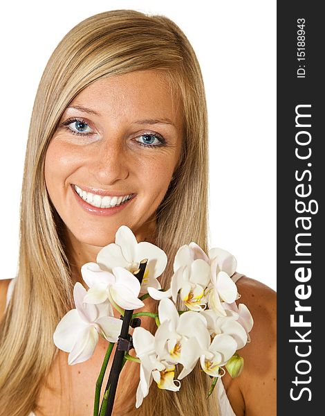 Young blond tan caucasian woman with orchid flowers isolated