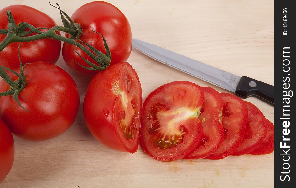 Tomatoes on Chopping Board