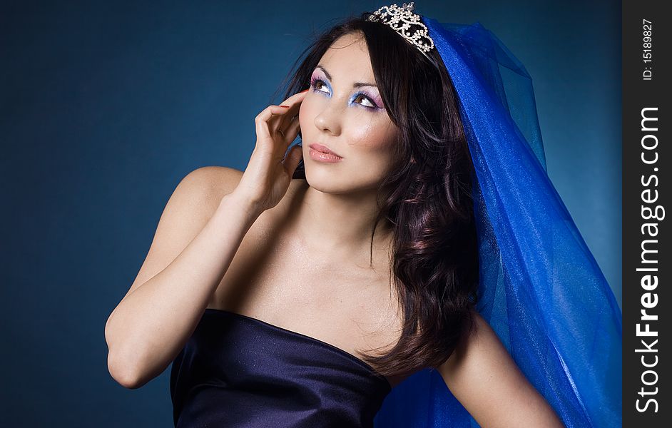 Beautiful girl with diamond crown and veil