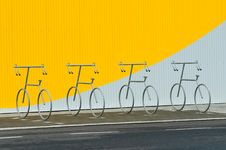 Four Bicycle Holders Royalty Free Stock Images