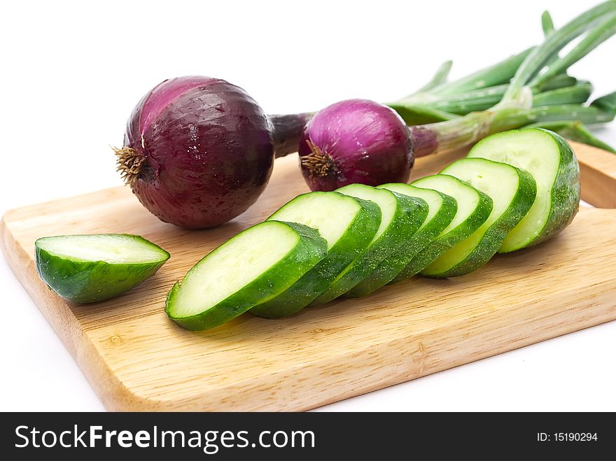 Green cucumber with slices and onion