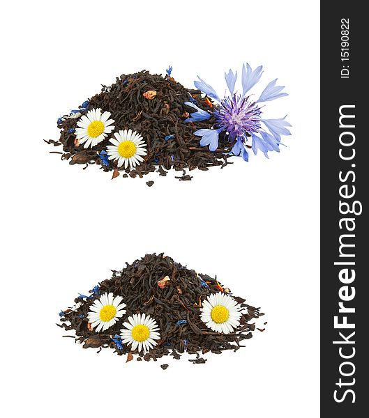 Two heaps of black mixed tea with camomiles and cornflower isolated on white. Two heaps of black mixed tea with camomiles and cornflower isolated on white