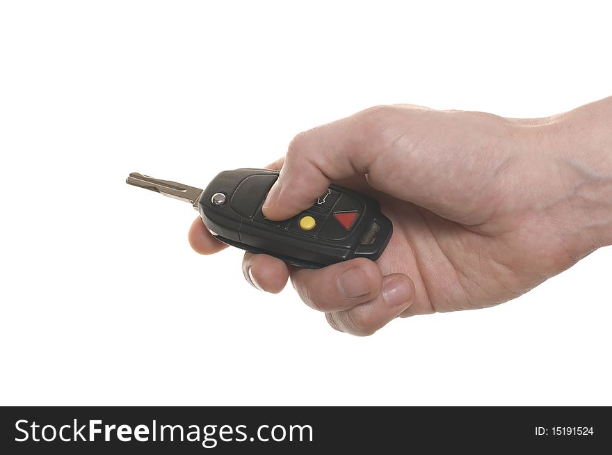 Men's hand with a car's key isolated over white
