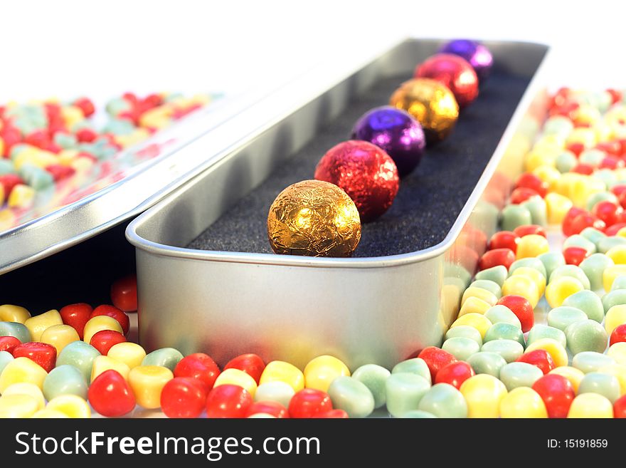 Chocolate balls in luxury package with white background