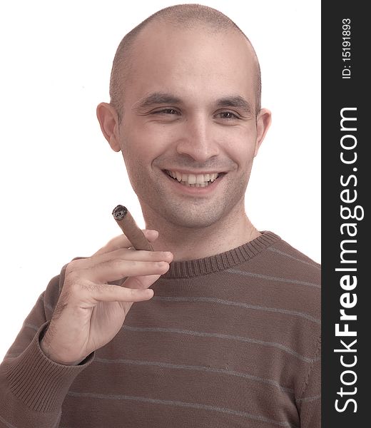 A young man smoking a big cigar. A young man smoking a big cigar