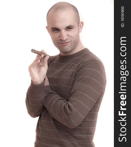 A young man smoking a big cigar. A young man smoking a big cigar