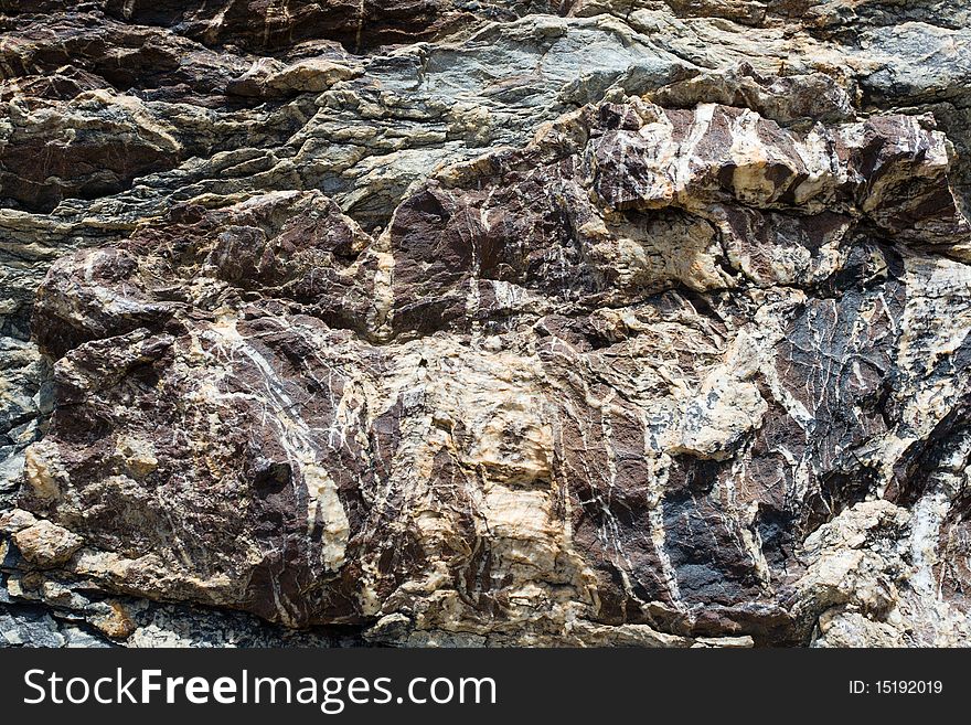 Dark brown with striae rock stone pattern, textured background. Dark brown with striae rock stone pattern, textured background